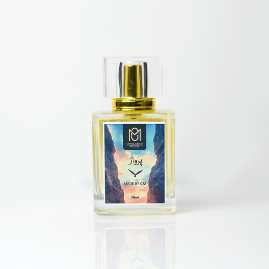 Perfume bottle with gold cap on a white background